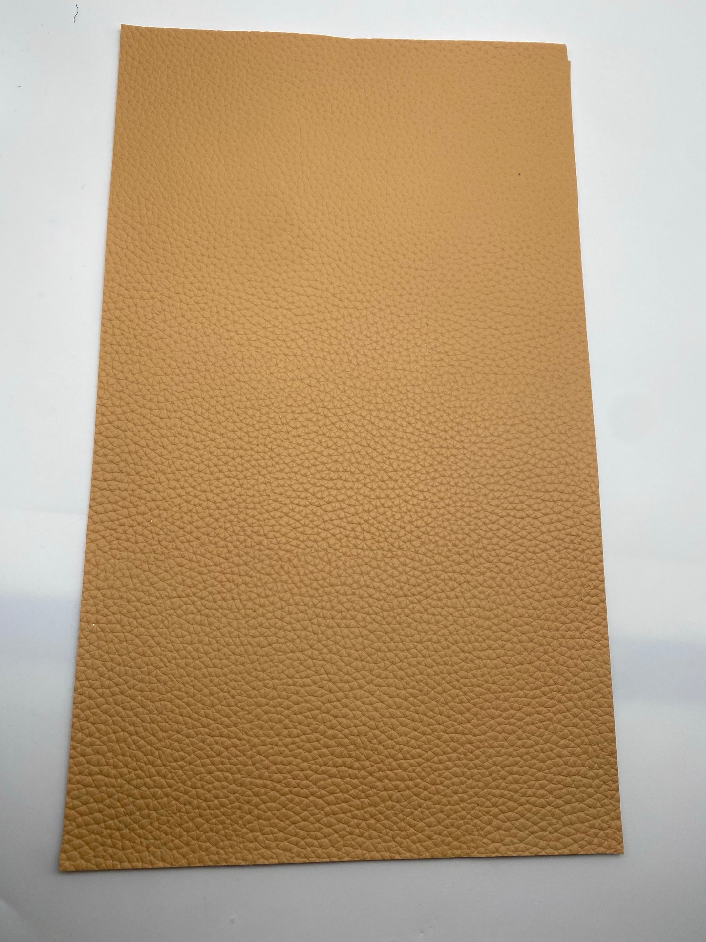 $1 CARAMEL/TAN SOLID PEBBLED FAUX LEATER SHEET